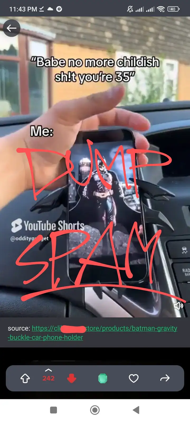 A hand holds a smartphone in a Batman-themed car mount inside a vehicle. The phone screen displays a YouTube Shorts video…