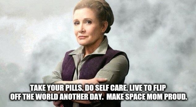A woman with her arms crossed, wearing a purple vest over a gray shirt, stands against a smoky background. The overlaid text…