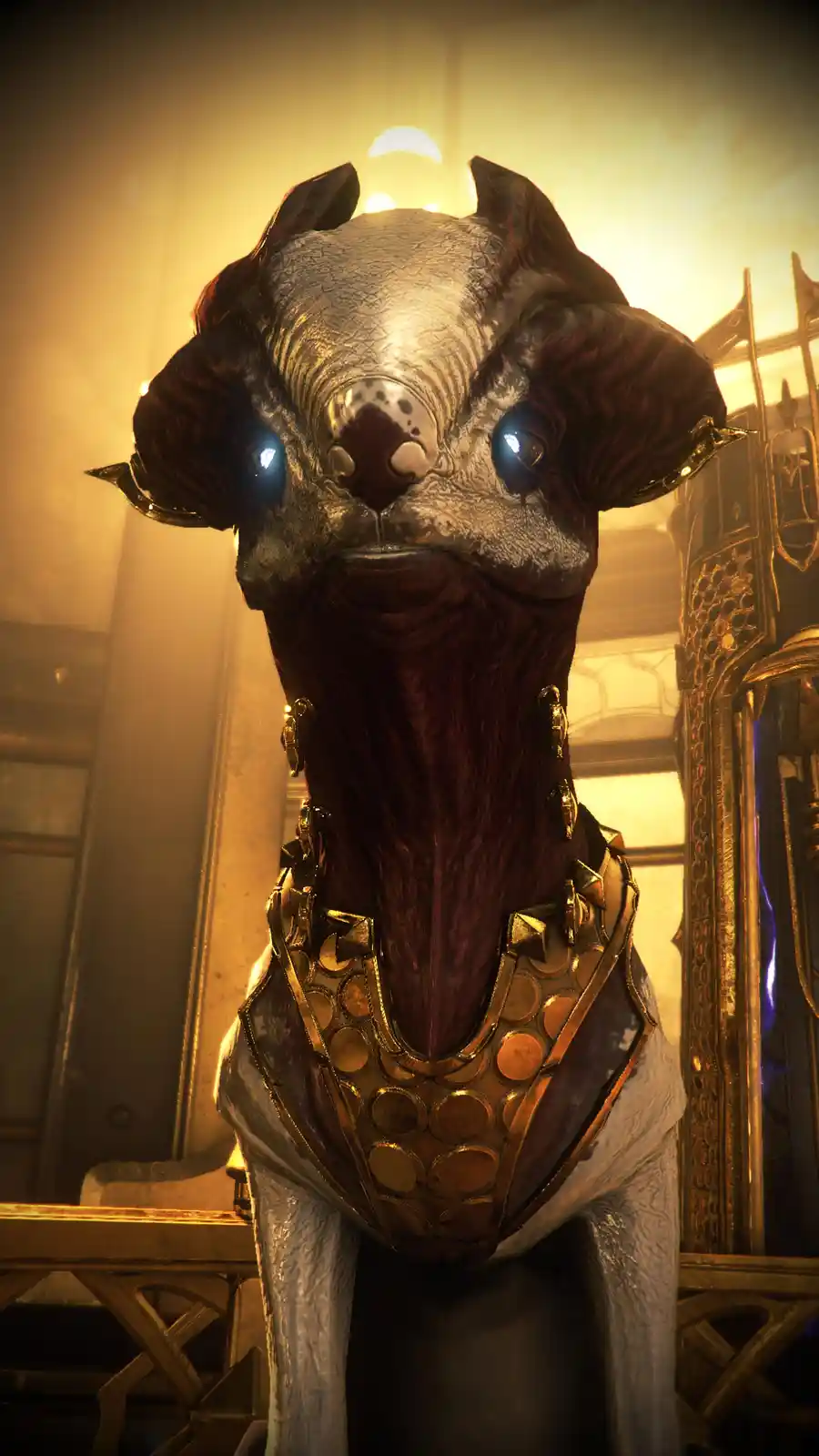 A close-up of a non-humanoid, dog-like alien creature with glowing blue eyes, textured grey and reddish-brown skin, and…