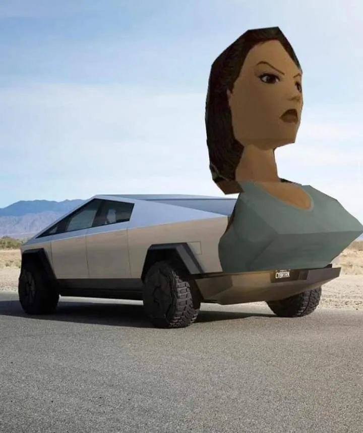 A silver Tesla Cybertruck is parked on a desert road with a large, low-polygon 3D-rendered female bust emerging from its…