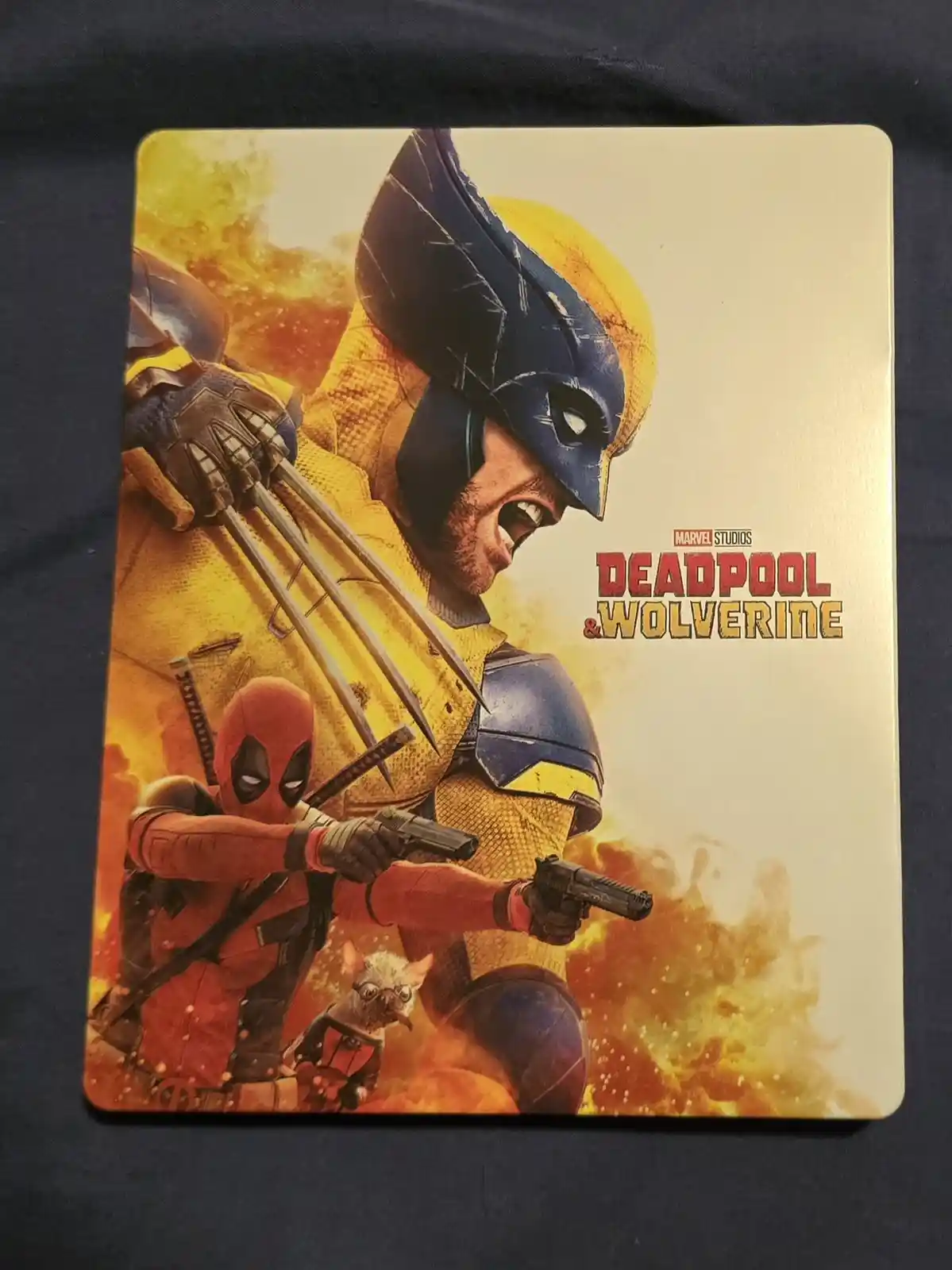 A promotional steelbook cover for the Marvel Studios movie 'Deadpool & Wolverine' shows Wolverine in his yellow and blue…