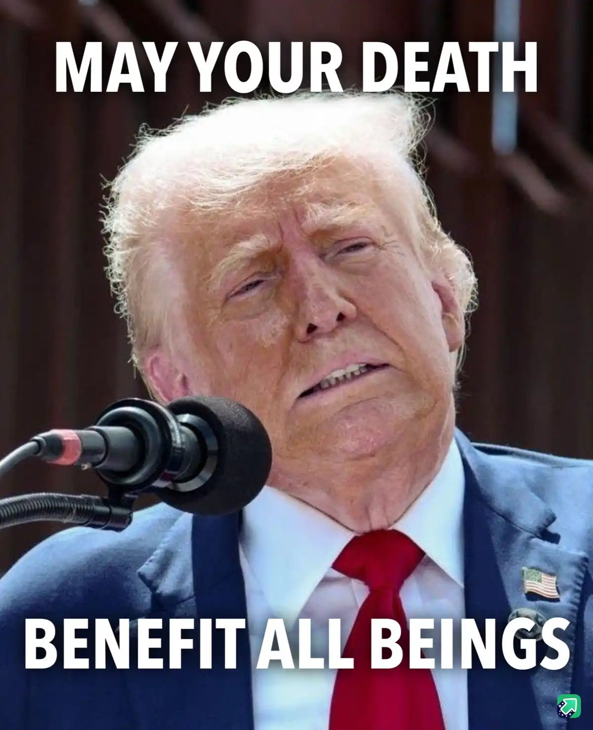 A close-up photo of Donald Trump looking tired and slightly annoyed, wearing a blue suit, white shirt, and red tie with an…
