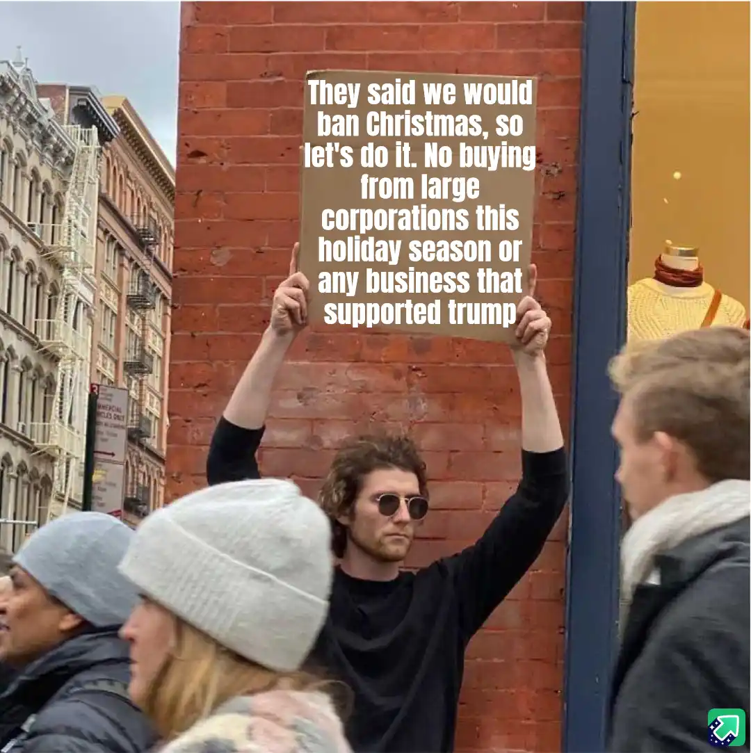 A man with curly hair and sunglasses holds up a cardboard sign in a city street, surrounded by pedestrians. The sign reads…