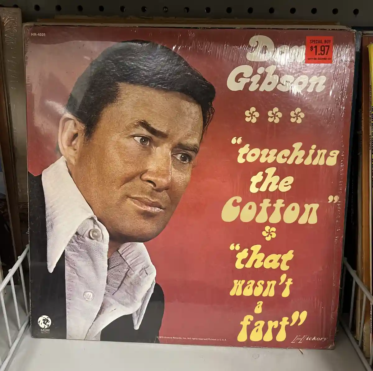 A vintage red vinyl record album cover for Dan Gibson featuring the title 'touching the Cotton' and the subtitle 'that…