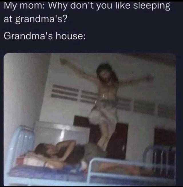 A low-resolution photo shows a person lying in a bunk bed while another person is suspended in mid-air above them, arms…