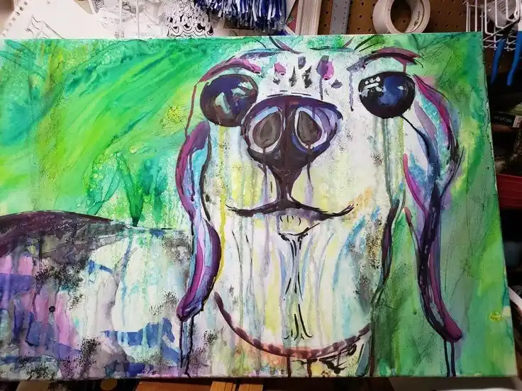 A colorful abstract painting of a dog's face with large, expressive eyes and long ears, set against a vibrant green and…