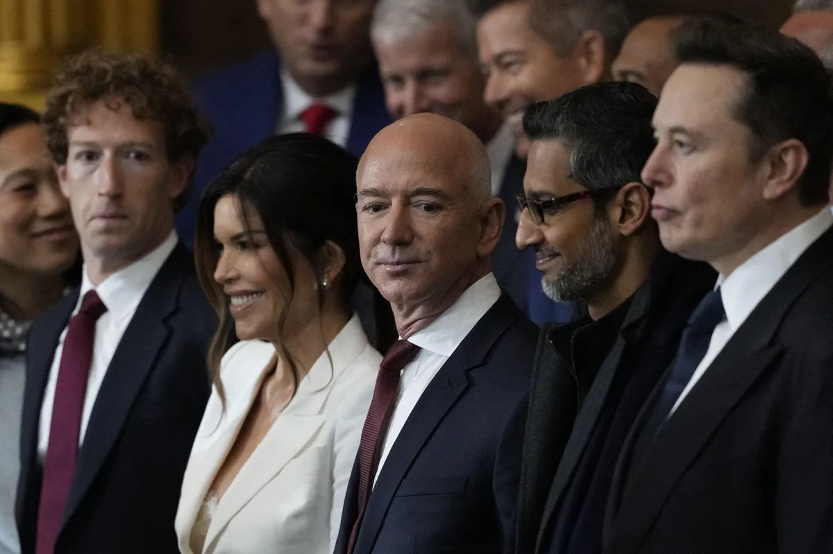 A group of tech billionaires, including Jeff Bezos, Mark Zuckerberg, Sundar Pichai, and Elon Musk, are standing side-by-side…