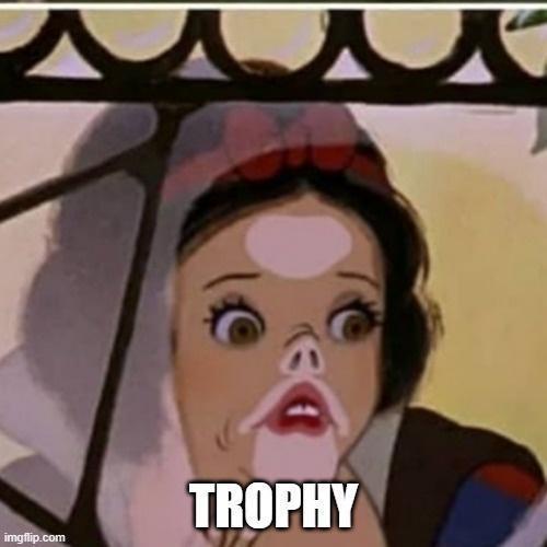 A close-up of Snow White from Disney's animated film, showing her with wide, shocked eyes and a slightly open mouth, as if…