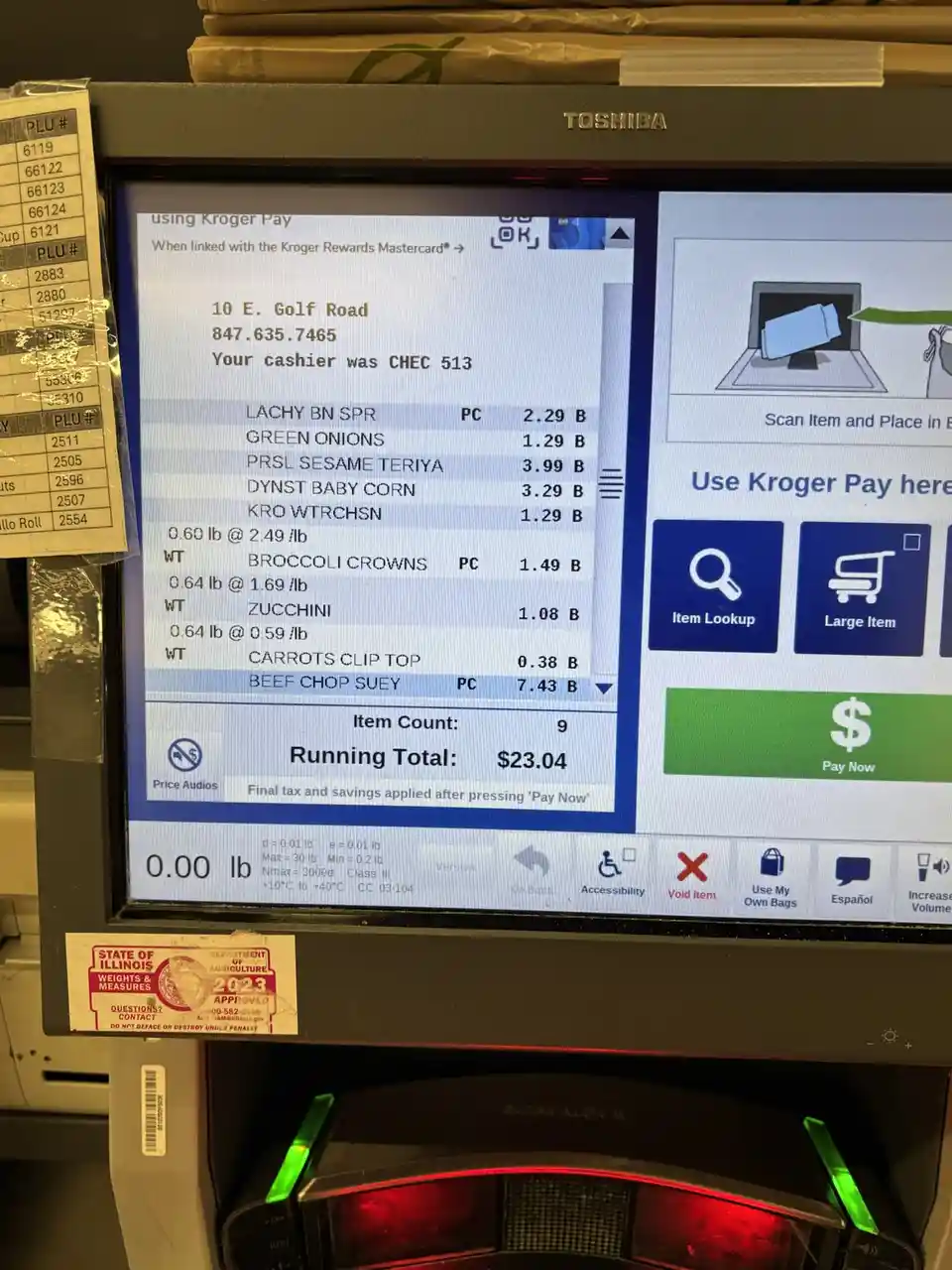 A close-up of a Kroger checkout screen showing a grocery receipt with items like broccoli, zucchini, and beef chop suey…