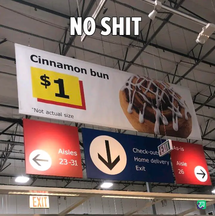 A large overhead store sign advertises a cinnamon bun for $1, with a disclaimer '*Not actual size' underneath. The sign is…