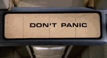 A sequence of six images shows a sign that starts with 'DON'T PANIC', then flickers and glitches, eventually displaying…