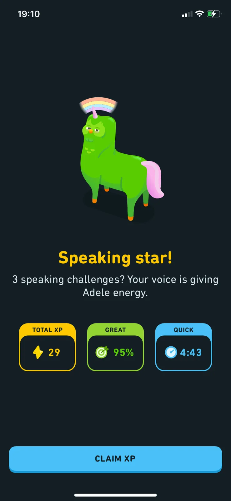 A green cartoon llama with a rainbow horn and pink tail stands on a dark screen. Below it, text reads 'Speaking star! 3…