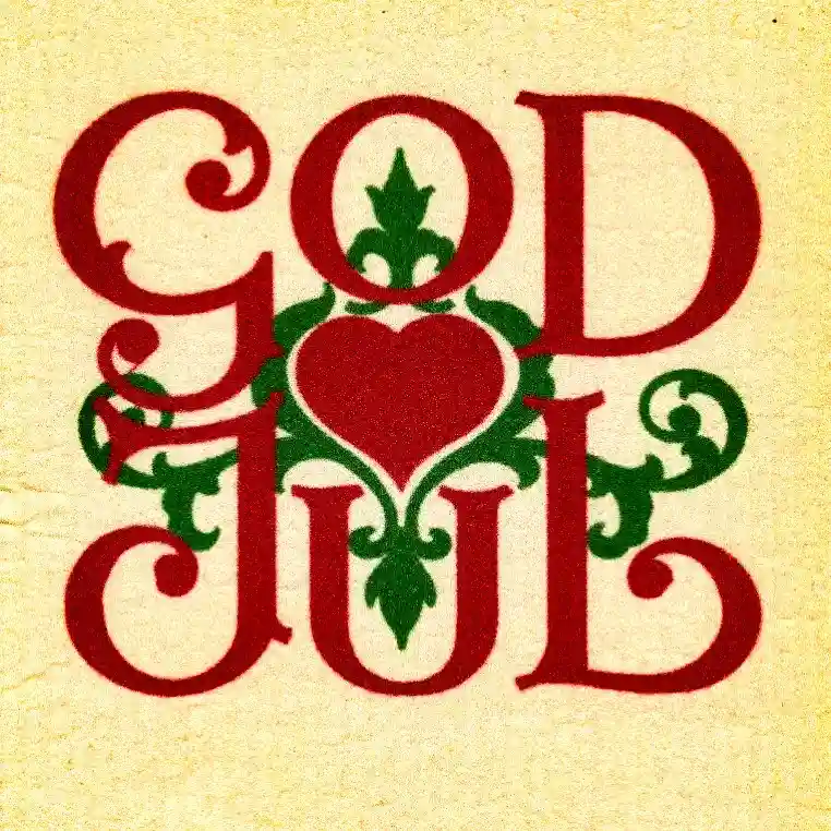 The image displays the phrase 'GOD JUL' in ornate red lettering on a textured beige background, with green decorative…