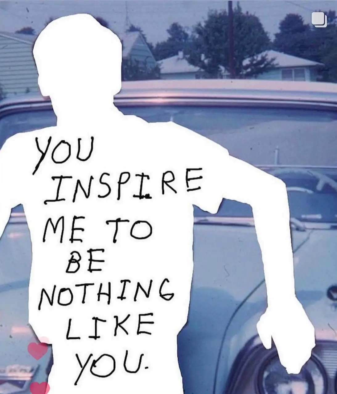 A white silhouette of a person standing in front of a vintage car with a suburban neighborhood in the background. The…