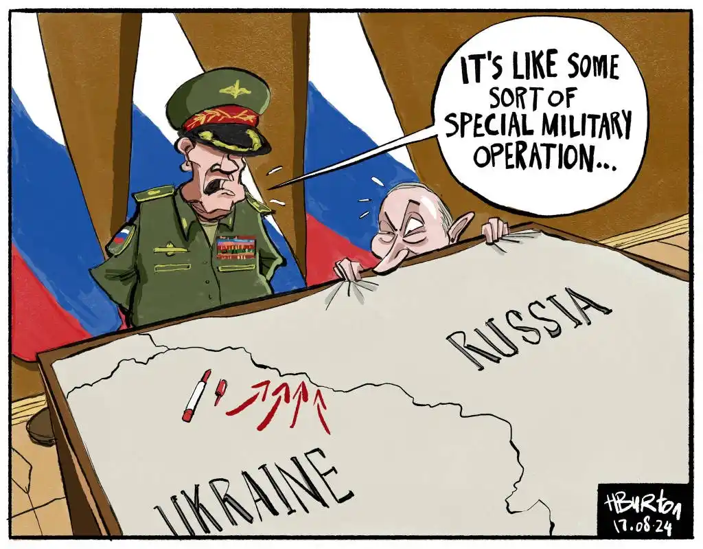 A cartoon depicts a stern Russian military officer standing beside a map labeled 'RUSSIA' and 'UKRAINE', while a caricature…