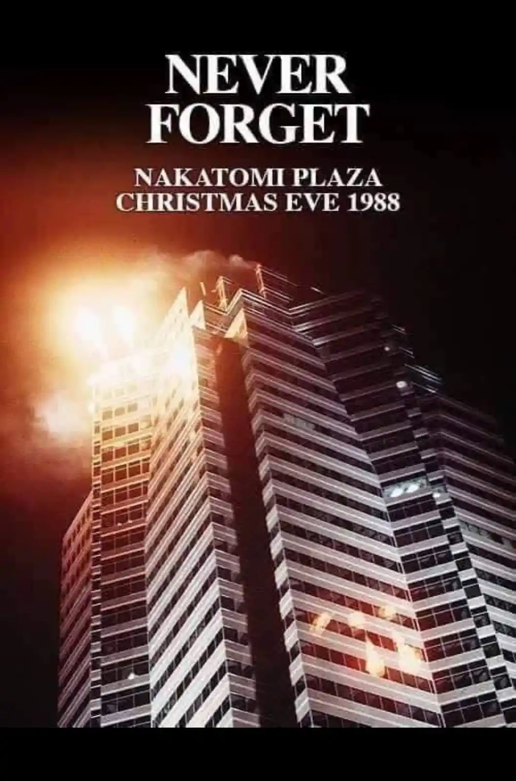 A dramatic nighttime photo of the Nakatomi Plaza skyscraper on fire, with large white text overlaid at the top reading…