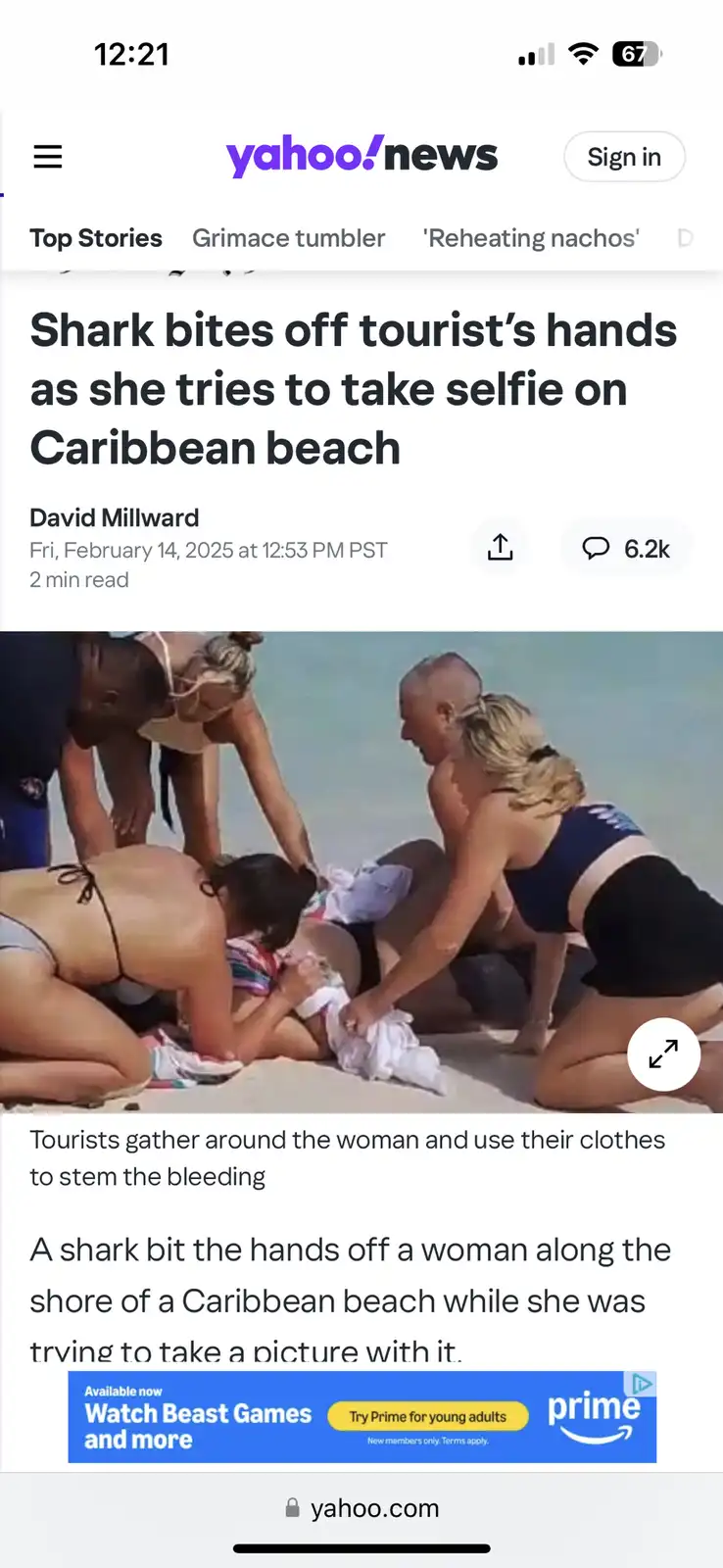 A screenshot of a Yahoo News article shows a woman on a Caribbean beach surrounded by people helping her after a shark…