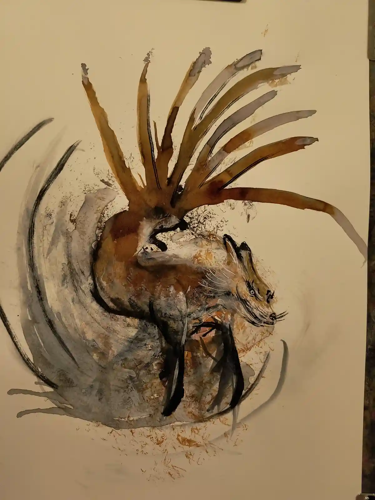 A watercolor painting depicts a fox with a lion's mane and tail, surrounded by swirling gray brushstrokes. The fox has a…