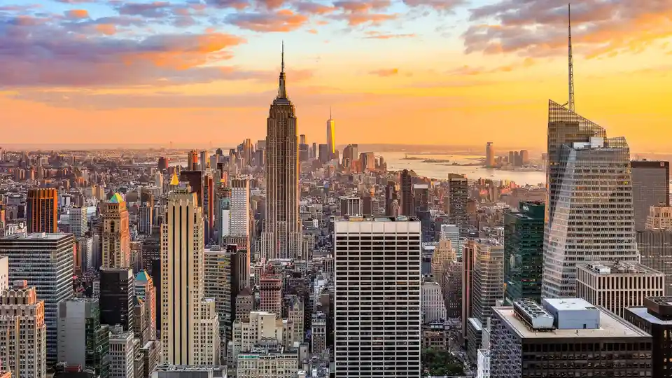 From 30 Rockefeller Plaza's high perch, gaze downtown to behold the iconic Empire State Building, an Art Deco masterpiece…