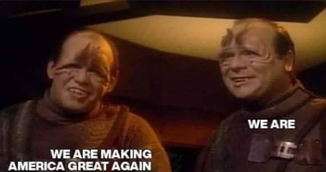 Two men with heavy makeup resembling alien characters from Star Trek: The Next Generation are shown in a dimly lit interior…