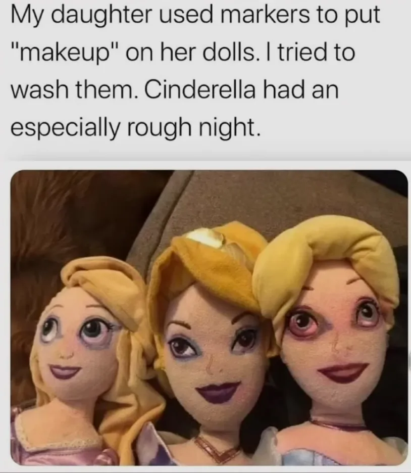 Three plush dolls resembling Disney princesses, likely Rapunzel, Tiana, and Cinderella, are shown with crudely drawn dark…