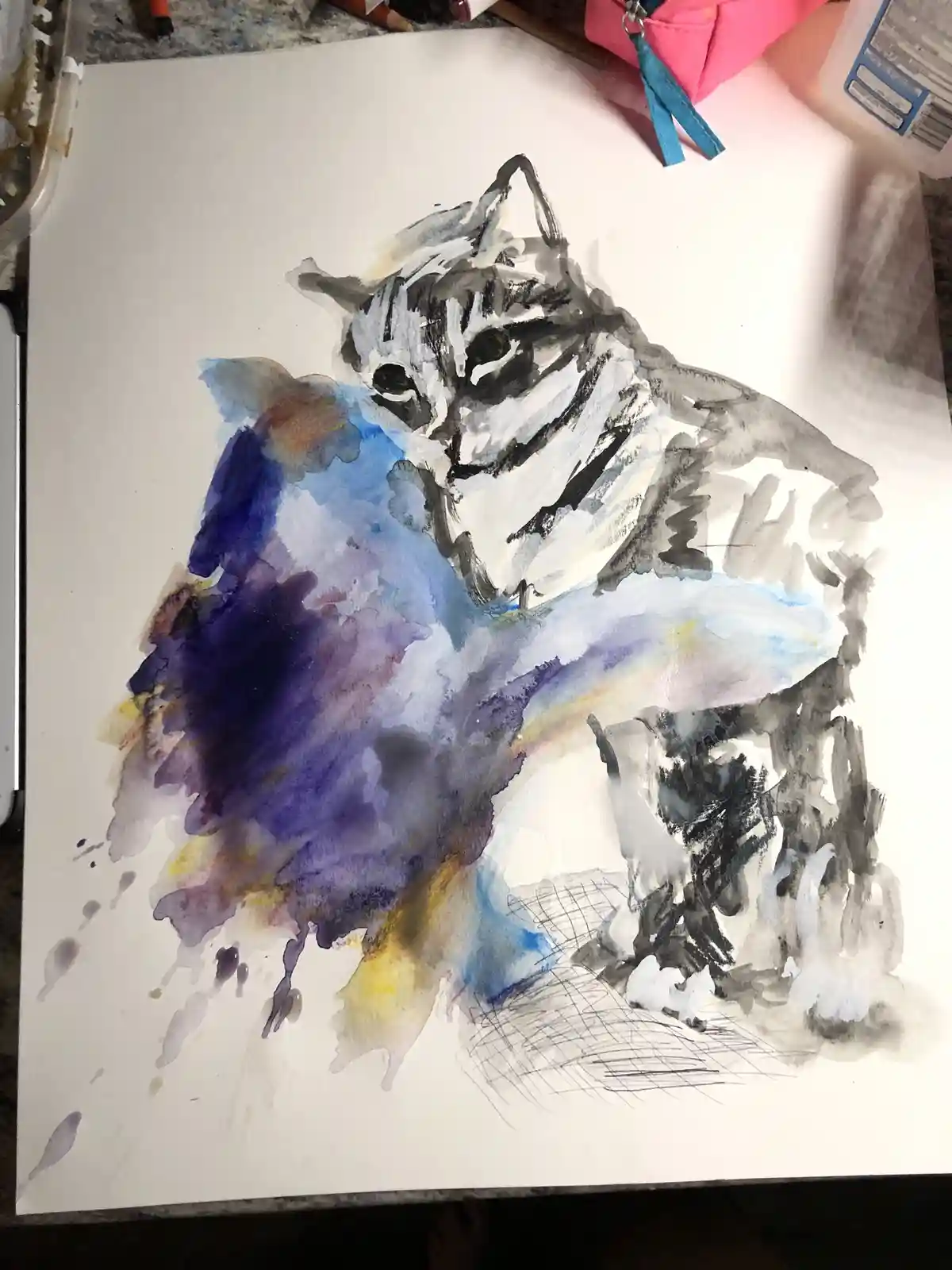 A watercolor painting on white paper depicts a cat with black and white ink outlines, but the body is a messy, abstract…