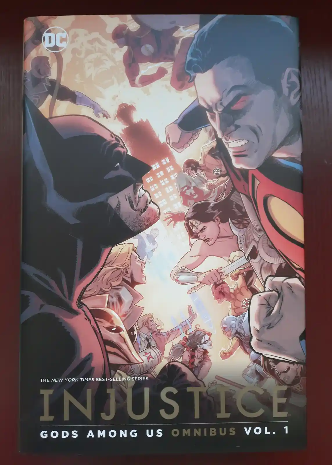 The cover of the DC Comics 'Injustice: Gods Among Us Omnibus Vol. 1' features a dramatic, action-packed illustration of…