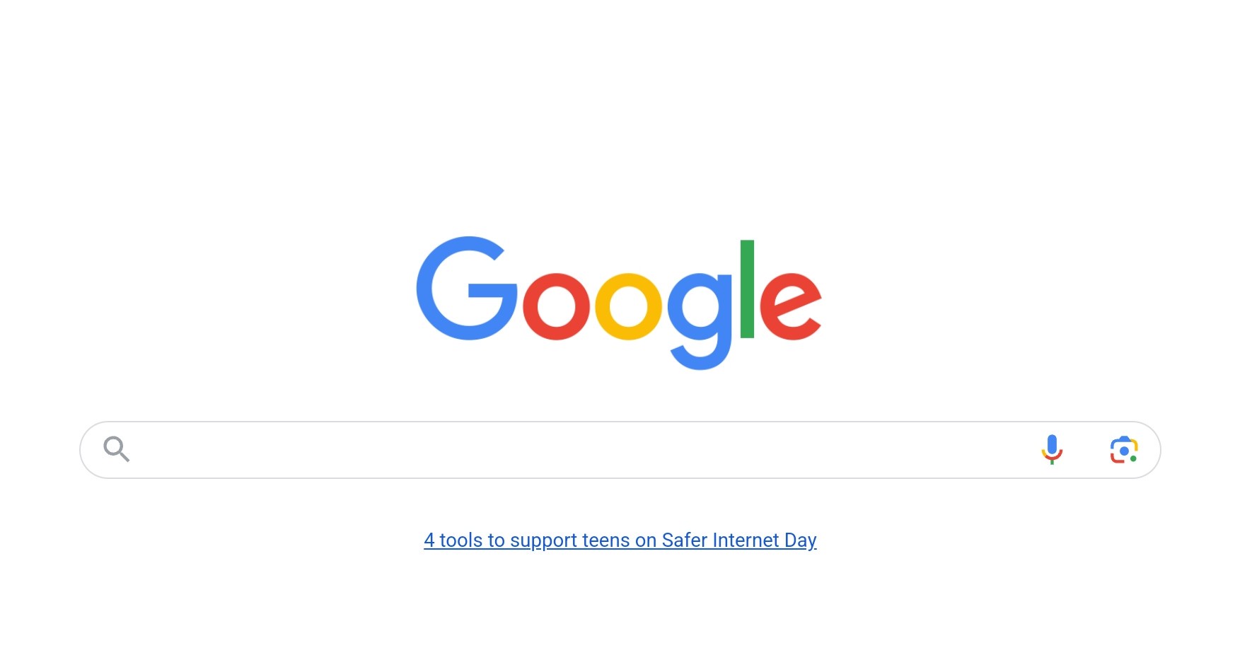 The image shows the standard Google homepage with its multicolored logo and search bar. Below the search bar, a blue…