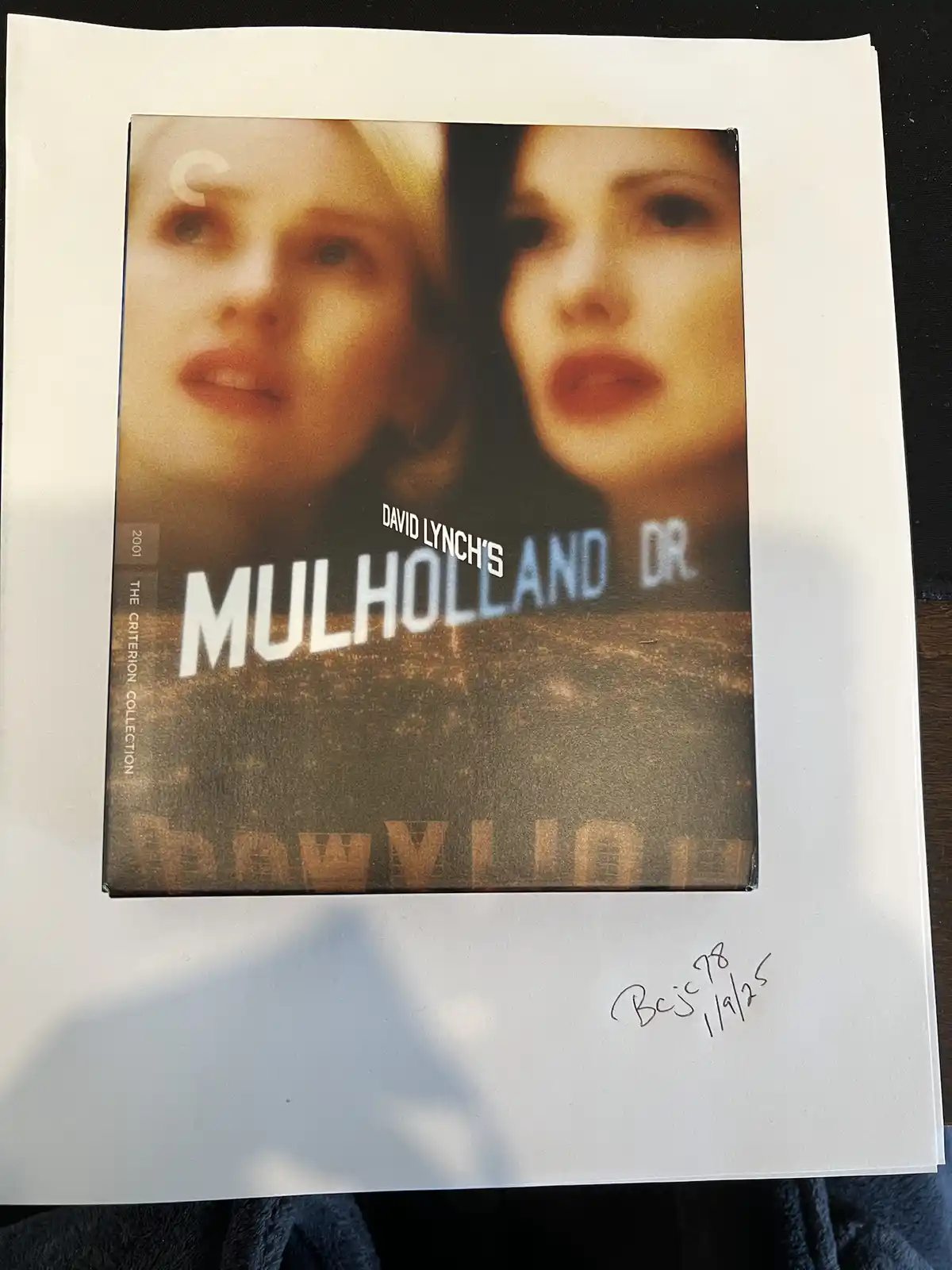 A photo of a Criterion Collection DVD box for David Lynch's Mulholland Dr. (2001), featuring the film's cover art with two…