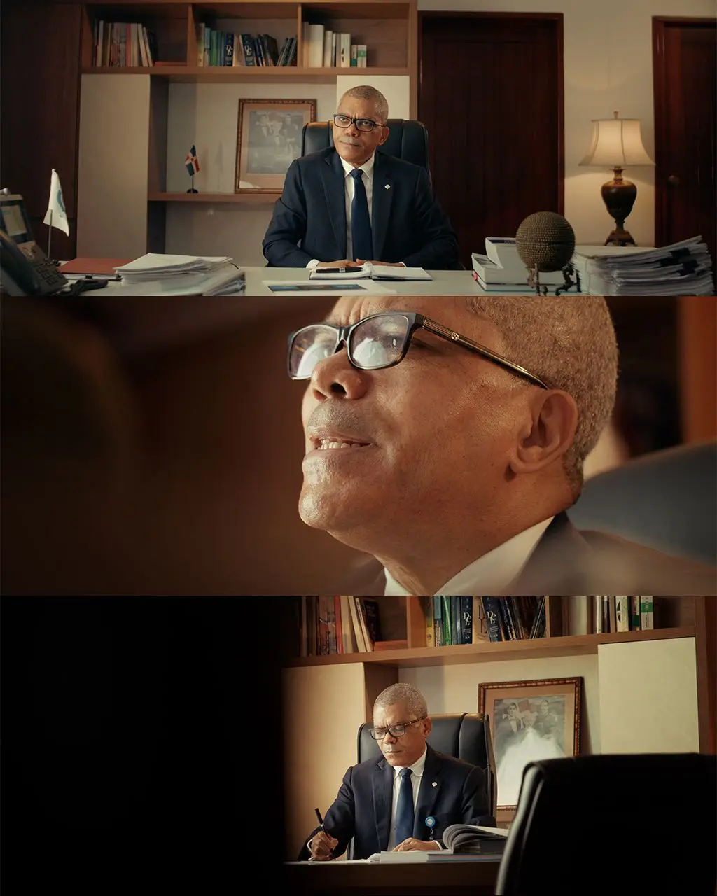 The image is a three-panel vertical collage showing a man in a suit and glasses sitting at a desk in an office. The top…