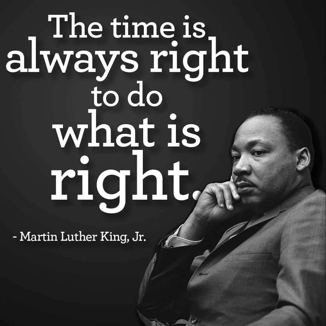 A black and white portrait of Martin Luther King, Jr. shows him in a suit, resting his chin on his hand, looking thoughtful…