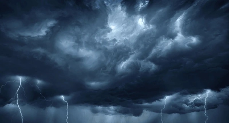 A dramatic image of a dark, stormy sky filled with heavy clouds and multiple lightning bolts striking down. Overlaid text…