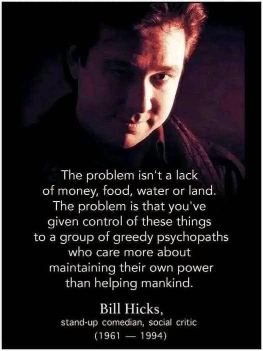 A darkly lit portrait of comedian Bill Hicks, with white text overlaid that quotes him: 'The problem isn't a lack of money…