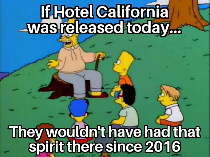 A still from The Simpsons shows an elderly Homer Simpson sitting on a tree stump, gesturing to a group of children around…