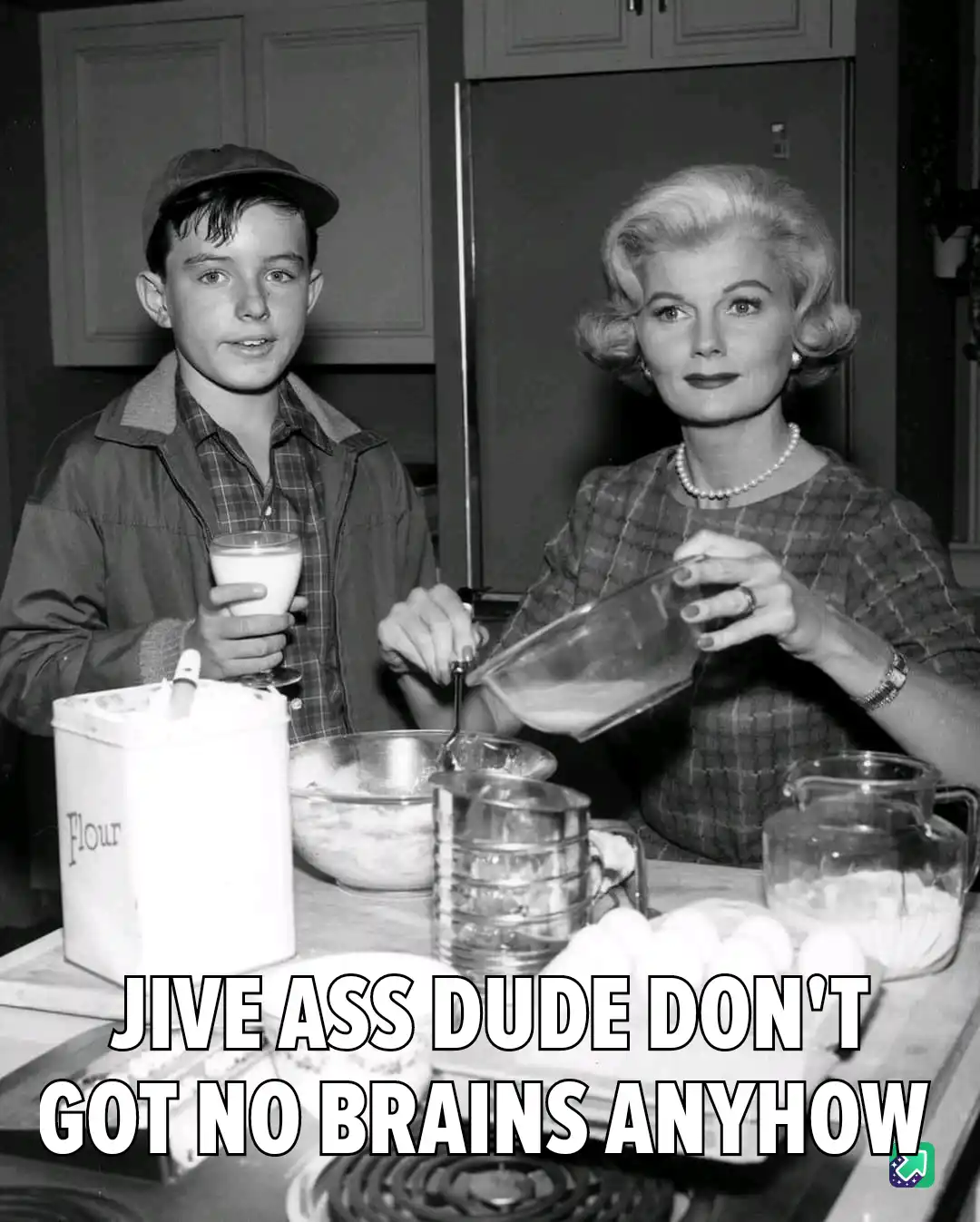 A black-and-white photo shows a young boy in a cap holding a glass of milk while standing beside a woman in a 1950s-style…