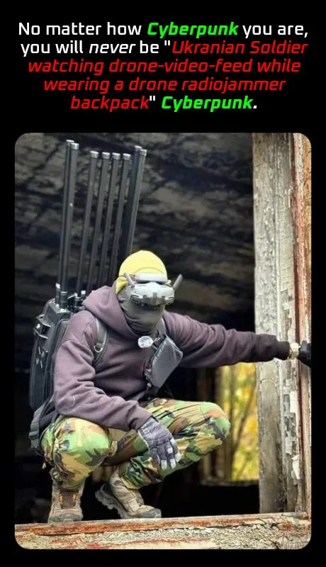 A soldier in camouflage pants and a purple hoodie crouches while wearing a yellow beanie, a tactical mask, and a backpack…