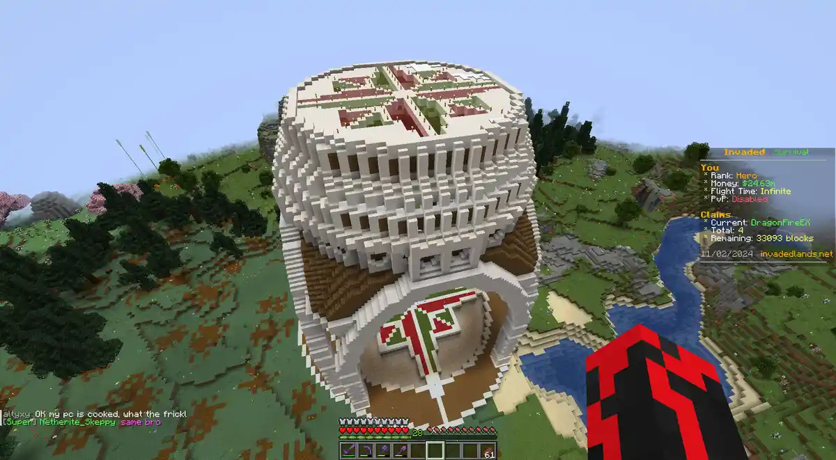 A screenshot from the Minecraft mod 'Invaded Survival' shows a massive, intricate, blocky structure resembling a giant…