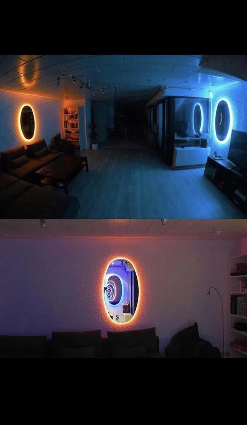The image shows a split-screen view of a modern living room with two oval mirrors on the walls, each illuminated by a…