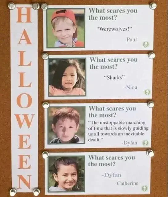 A Halloween-themed bulletin board displays four children's photos with their answers to 'What scares you the most?' Paul…