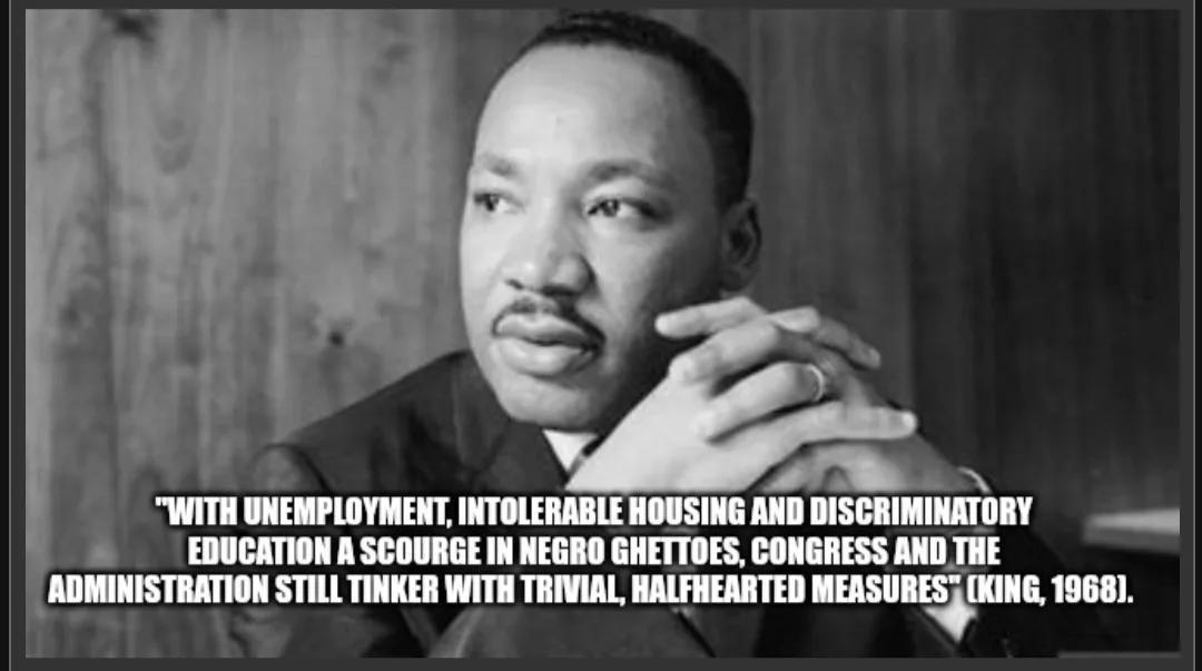 A black and white photo of Martin Luther King Jr. looking thoughtful with his hands clasped. Overlaid text quotes him from…