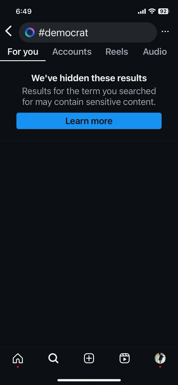 A screenshot of a mobile app interface showing a search for '#democrat' that has been blocked, with a message stating 'We've…