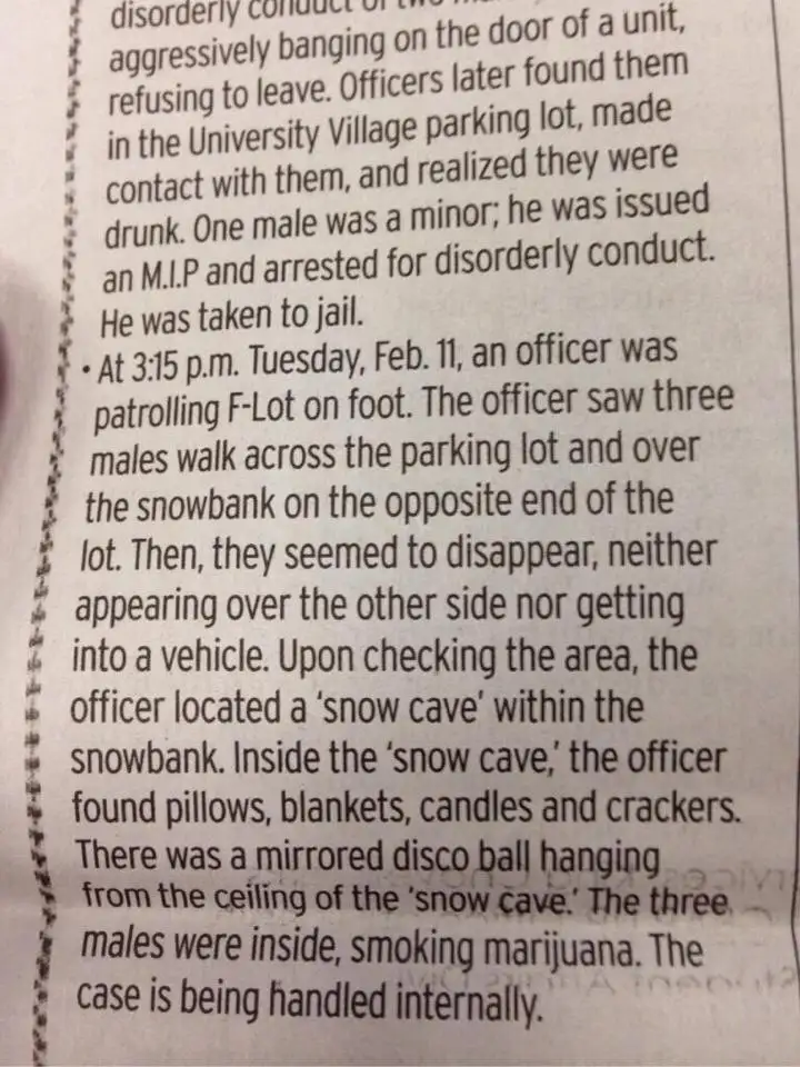 A close-up photo of a printed police report detailing an incident where three males were found inside a 'snow cave' in a…