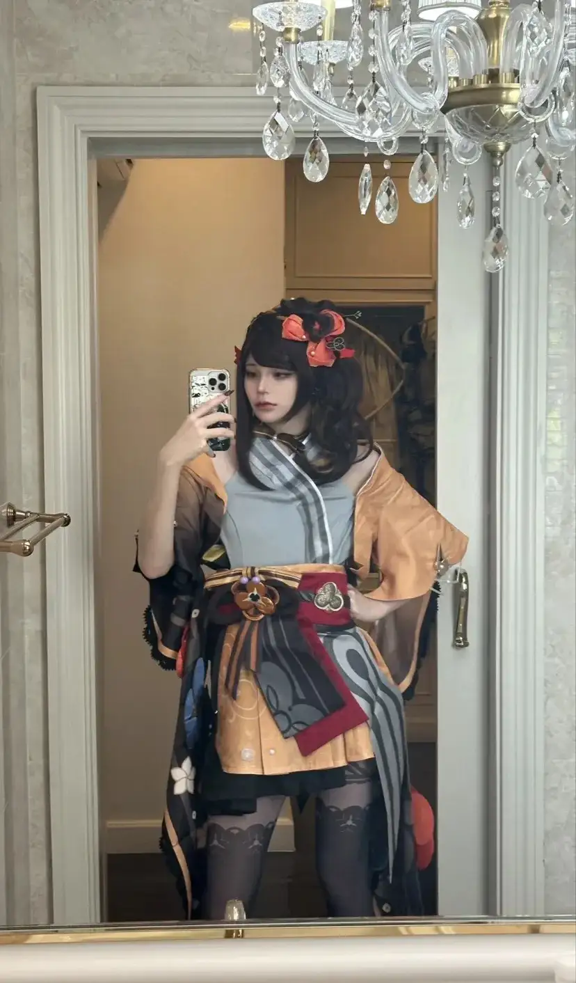 A person in a detailed cosplay outfit, resembling a character from a video game, takes a mirror selfie in a luxurious…