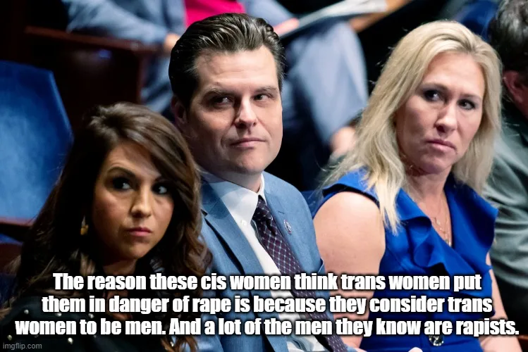Three people sit in an audience, looking concerned or skeptical. The person in the center, a man in a suit, stares forward…