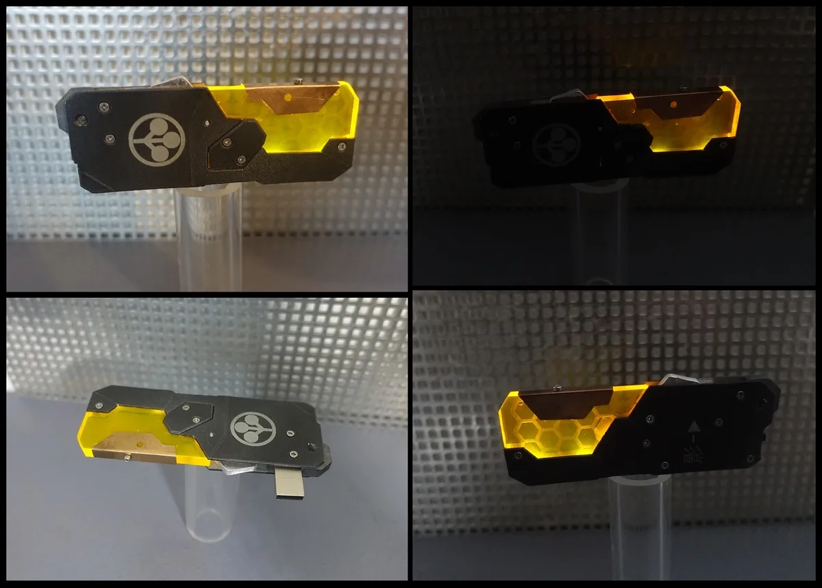 four images show a custom usb drive designed to look like a futuristic blade with a glowing yellow translucent section and a…
