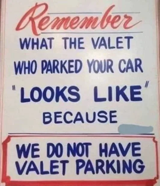 A vintage-style sign with red and blue text advises patrons to remember the appearance of the valet who parked their car…