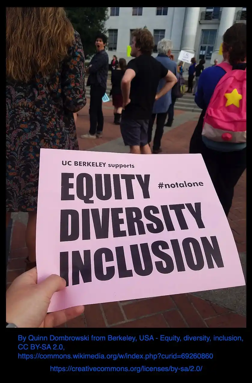 A hand holds a pink protest sign at UC Berkeley that reads 'UC BERKELEY supports EQUITY #notalone DIVERSITY INCLUSION' in…