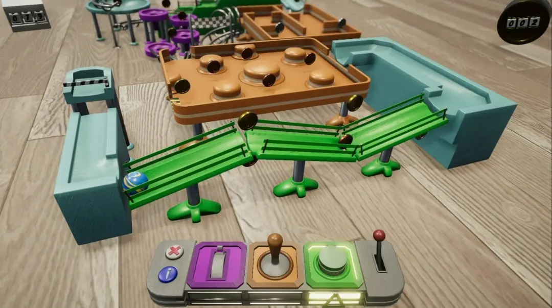 A screenshot from a video game showing a blue ball rolling down a green track toward a target area, with a control panel at…