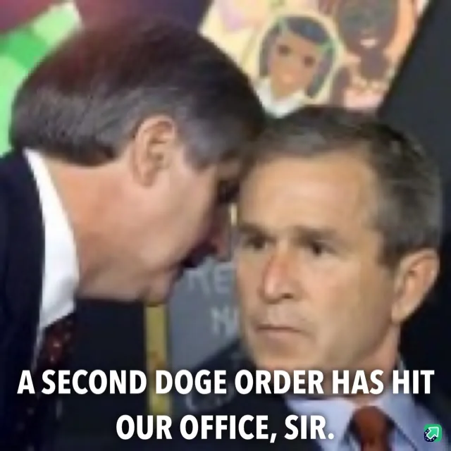 Two men in suits are shown in a close-up, one leaning in to whisper to the other who looks forward with a neutral…