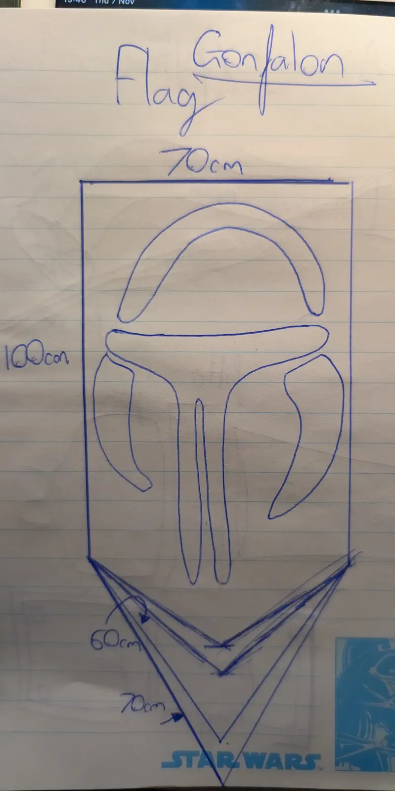 A hand-drawn blue ink sketch on lined paper shows a flag design labeled 'Flag Gonfalon' with dimensions: 70cm width, 100cm…
